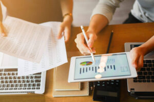 Two people studying graphs of their annuity payments